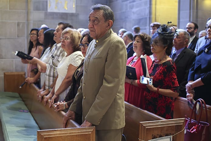 (Front row, foreground to background) Juan and Nancy Ortega traveled from Venezuela to watch their son, Carlos, become a priest for the Archdiocese of Atlanta. Photo By Michael Alexander