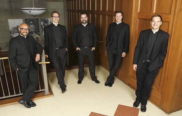 The newest priests for the Archdiocese of Atlanta include (l-r) Father Carlos Ortega, Father Michael Bremer, Father Jack Knight, Father Michael Metz and Father Brian McNavish. They were ordained to the priesthood by Archbishop Wilton D. Gregory on June 16 at the Cathedral of Christ the King, Atlanta. Photo By Michael Alexander