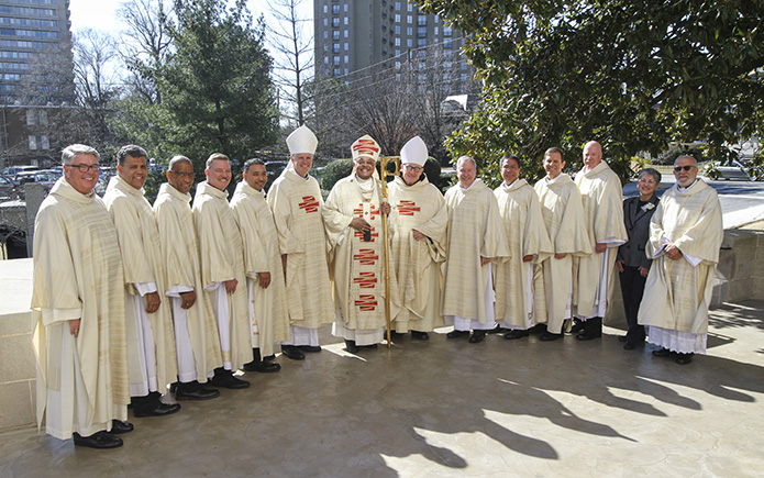 Standing on the Cathedral of Christ the King plaza for a group photograph following the rite of ordination to the diaconate are (l-r) Deacon Dennis Dorner, permanent diaconate director, new deacons, Randy Ortiz, Nicholas Goodly, Timothy Tyre and Facundo Maldonado, Bishop Bernard E. Shlesinger III, Archbishop Wilton D. Gregory, Abbot Cletus Meagher, OSB, of St. Bernard Abbey, Cullman, Alabama, new deacons Stephen Gross, Guillermo Hedy Sevilla, Thomas Nemchik and Timothy Dimond, and Office of the Permanent Diaconate associate co-directors of formation, Penny Simmons and Deacon José Espinosa. Photo By Michael Alexander