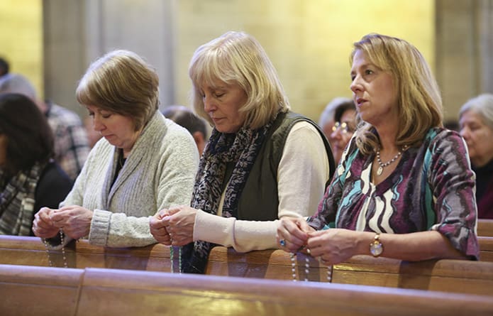 Kate Lisska, Anne Holdsworth and Cathy Schneider of St. Brigid Church, Johns Creek, pray the rosary prior to the annual Mass for the Unborn at the Cathedral of Christ the King, Atlanta. Photo By Michael Alexander