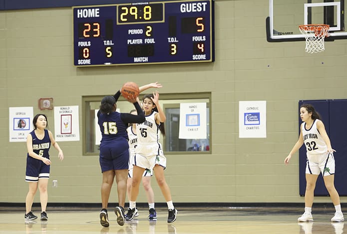 It's number 15 on number 15 during the Jan. 31 game between Notre Dame Academy, Duluth, and Brandon Hall School, Atlanta. Notre Dame Academy guard Luisa Smolynsky, facing the camera, plays defense against her Brandon Hall School opponent. Photo By Michael Alexander