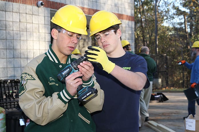 Juniors Dario Zaccagnino, left, and Ben Barre change out a drill bit during the second build day last Nov. 28. Photo By Michael Alexander
