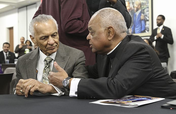 On April 4, 2018 Archbishop Wilton D. Gregory, right, chatted with Rev. C.T. Vivian during the Martin Luther King Jr. Nonviolent Peace Prize Awards Luncheon. The 94-year-old Vivian was a close friend and ally of Dr. Martin Luther King during the Civil Rights Movement. Photo By Michael Alexander