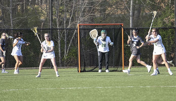 Blessed Trinity goalie Megan McCarthy (#29) vocally implores her teammates to get ready as Cambridge High School prepares to mount an offensive attack. Photo By Michael Alexander