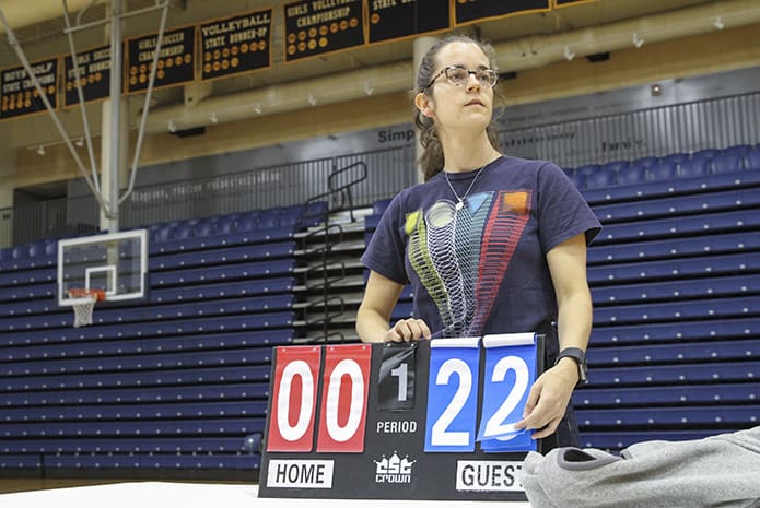 Brittany Berger was one of two scorekeepers for L'Arche Madness. Berger was part of the CTK (Cathedral of Christ the King) 20/30 Somethings group that served as volunteers for the event. Photo By Michael Alexander