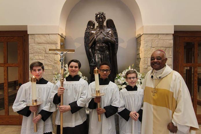Archbishop Gregory takes a picture with the altar servers at the 2019 8th grade archdiocesan Mass and lunch sponsored by St. Catherine of Siena School, Kennesaw at St. Michael Church, Woodstock.