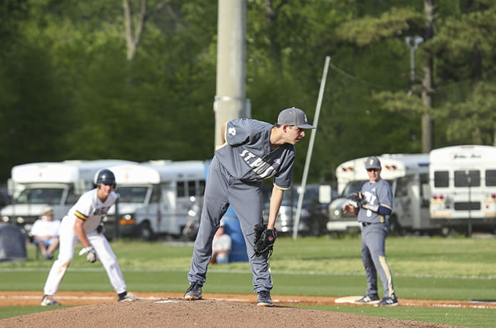 In the second inning, St. Pius X's Anthony Ficco, center, came in to replace the team's starting left-handed pitcher. Photo By Michael Alexander
