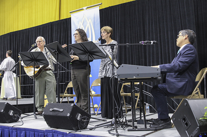 Two married couples made up the quartet of musicians for the farewell Mass. Ken Macek, far left, played the guitar as his wife Elyn, second from right, sang. Bob Amar, far right, played the keyboards as his spouse Deanna, second from left, also sang. Photo By Michael Alexander