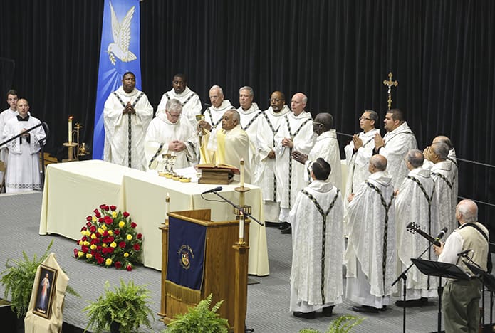 Archbishop Wilton D. Gregory elevates the chalice during the consecration at his farewell Mass. Photo By Michael Alexander