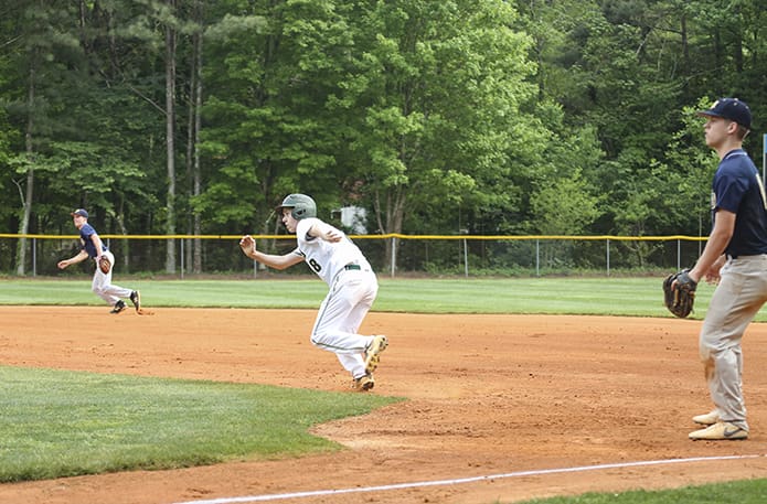 After his teammate Jackson King gets a base hit during the second inning, Holy Spirit Prep second baseman Aiden Schultz (#8) takes off running from first base and makes it to third base to put his team in scoring position. Holy Spirit Prep came from behind to defeat Atlanta’s Brandon Hall School in the April 25 game 13-3. Photo By Michael Alexander