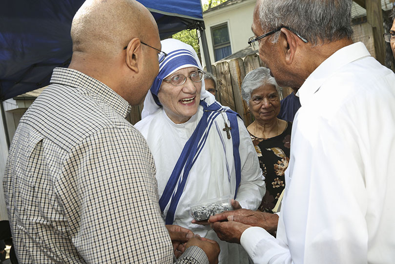 Sister Mary Prema, MC, superior general of the Missionaries of Charity, greets people following a June 29 Mass at Gift of Grace House, Atlanta. She also handed out religious medals of St. Teresa of Calcutta. Photo By Michael Alexander