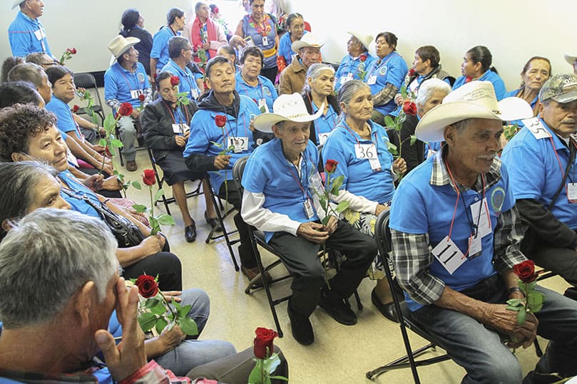 The 44 elderly parents, who arrived from Mexico, sat in a room until they were individually called by name and reunited with their children during an Aug. 7 reception at Our Lady of the Americas Mission, Lilburn. The parents were granted temporary visas, so they could spend 20 days with their children and their families. Photo By Michael Alexander