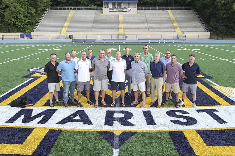 Some of the coaches and players from the 1989 Marist School football team came together in August for a group photo on the 50-yard-line of the school’s Hughes Spalding Stadium. Thirty years ago the team won the state championship and finished the season 15-0. (Front row, left to right) Matt Post; Stewart Williams; Coach Dan Perez; Coach Gary Miller; Coach Alan Chadwick; Coach Steve Franks; Brian Harron; Tim Winterstein and Mike MacLane; (Back row, left to right) Todd Stanton; Matt Greco; Boyd Andrews; Franklin Vincent Cox III; Chris Millen and Rob Heller. Photo By Michael Alexander