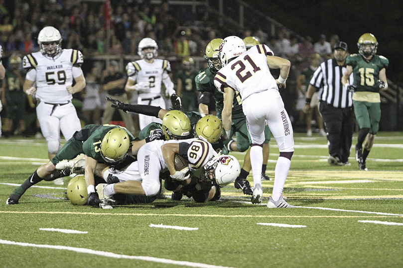 Hochman, Jeffords and Kiernan take Baker (#86) down to complete the play. Pinecrest Academy is looking to end a four-game losing streak when they play on the road Oct. 4. Photo By Michael Alexander