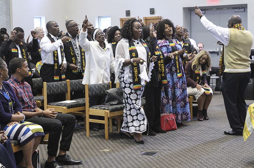 The Ghanaian Catholic Community choir from St. Patrick Church, Norcross, sing the offertory hymn, “Aseda nyina ye wo dze,” which literally means “All Praise and Thanks to God.” The choir is under the direction of Abraham Kwasi, far right. Photo By Michael Alexander