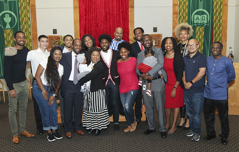 Former and current students of Lyke House, the Catholic Center at Atlanta University, from 2001 to the present, gather for a photograph at the conclusion of the 20th anniversary dedication Mass. Photo By Michael Alexander