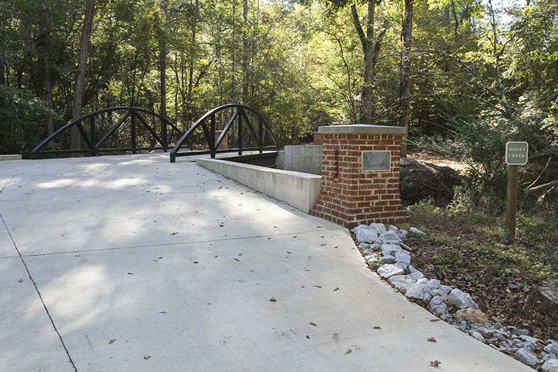 The Bridge to Grace, which takes people over Honey Creek to the burial grounds, opened in 2017. It was built in memory of Catherine Grace Schaffer, who only lived a few hours after her Oct. 9, 2015 birth. Photo By Michael Alexander