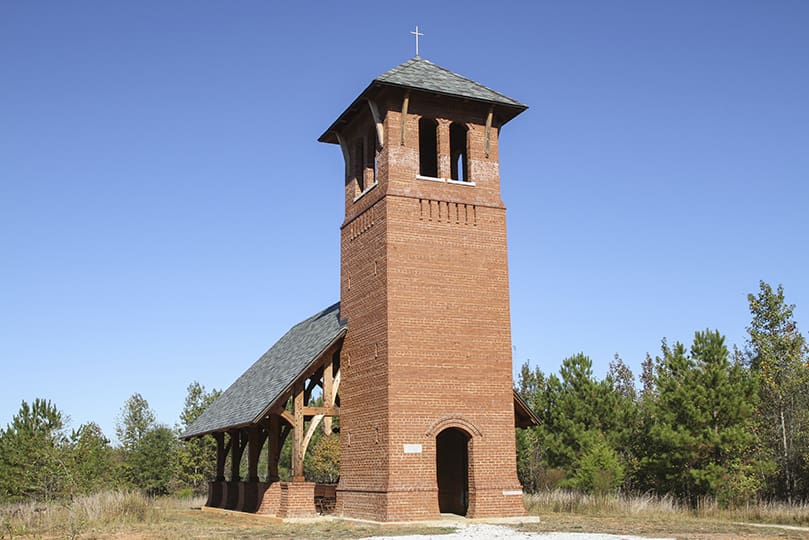 The Martin Gatins Chapel, a cedar-framed structure, with a brick bell tower, is in the Hill Top section of Honey Creek Woodlands, Conyers. The chapel, which opened in 2016, was made possible through the late Martin Gatinsâ generous donations to the Monastery of the Holy Spirit. Photo By Michael Alexander