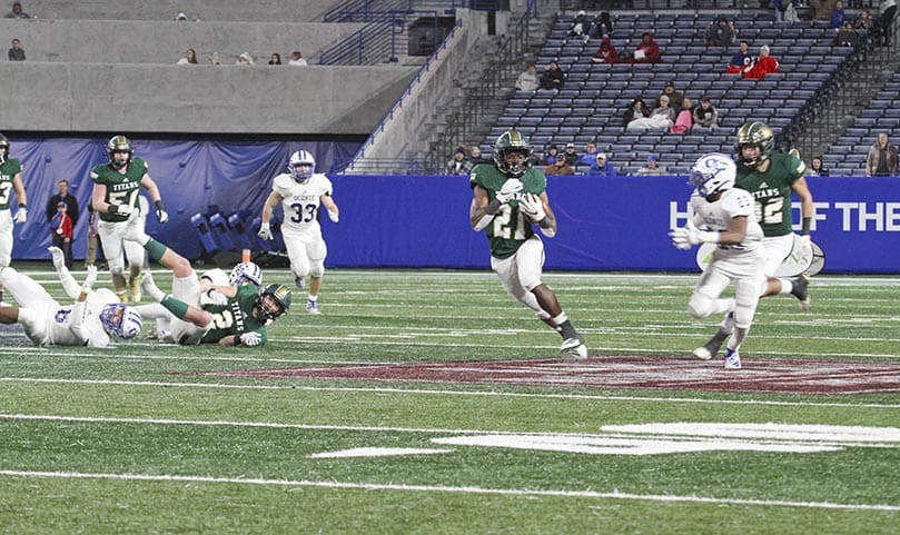 With 27 seconds remaining in the first half, Blessed Trinity High School running back Elijah Green (#21) attempts to run for his second touchdown of the game. Photo By Michael Alexander