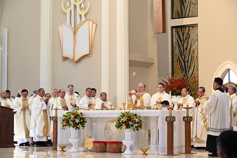 Joined around the altar by concelebrants within and outside the Archdiocese of Atlanta, Bishop Joel M. Konzen, SM, center, conducts the consecration during the Liturgy of the Eucharist at the Nov. 28 Mass of dedication. Photo Courtesy of Holy Vietnamese Martyrs Church