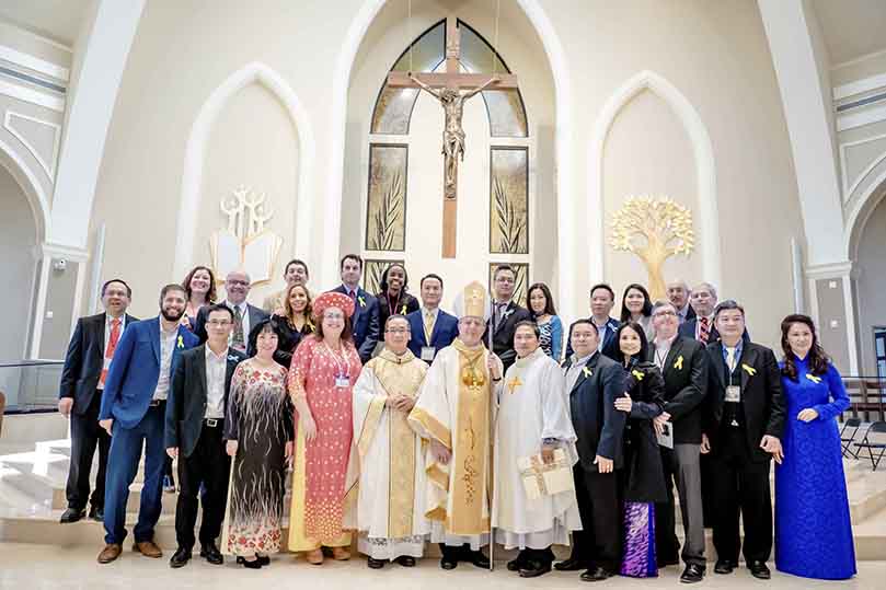 On the day of the dedication for Holy Vietnamese Martyrs Church, Norcross, a number of people who worked so diligently on the project were attendance. The front row attendees included (l-r) Sebastian Garcia, Sizemore Group junior architect, Mr. &amp; Mrs. Vu Dinh Lam, Paris based artist, sculptor and liturgical art consultant, Lynette Howard, former District 2 Gwinnett County Commissioner, Father Francis Tuan Q. Tran, pastor, Bishop Joel M. Konzen, SM, Father Tuan-Anh N. Pham, parochial vicar, Mr. &amp; Mrs. CC Nguyen, building committee members, Bill de St. Aubin, Sizemore Group lead architect, and Mr. &amp; Mrs. Danh Nguyen, pastoral council chairman. Photo Courtesy of Holy Vietnamese Martyrs Church