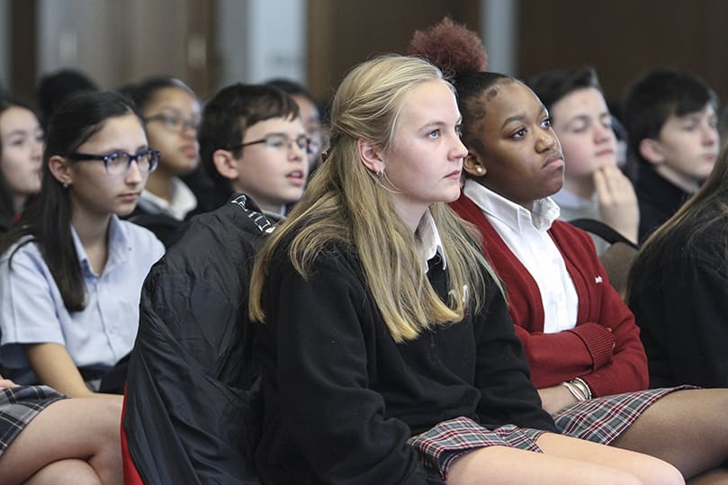 Our Lady of Mercy High School sophomores Erica Bryant, front row, left and Trinity Henry attend the archdiocese’s first Youth Rally for Life in the Cathedral of Christ the King’s Kenny Hall. The school’s entire sophomore class attended the Mass and rally as part of their sophomore retreat. Photo By Michael Alexander