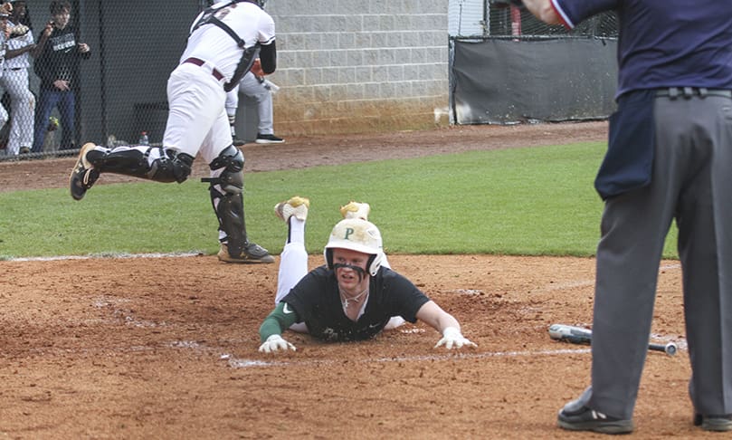 Hochman slides safely into home plate.