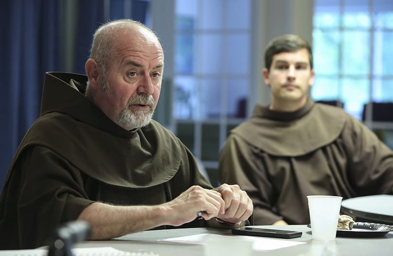 Franciscan Fathers Frank Critch, foreground, and Casey Cole, participate in a transitional meeting for incoming priests Father Fred Wendel and Father Brian McNavish. The Franciscan Friars of Holy Name Province will relinquish spiritual direction and leadership of Catholic Center at the University of Georgia, Athens, beginning in July, after more than 60 years. Father Critch is the outgoing director and Father Cole is the outgoing Catholic Student Association coordinator. Photo By Michael Alexander