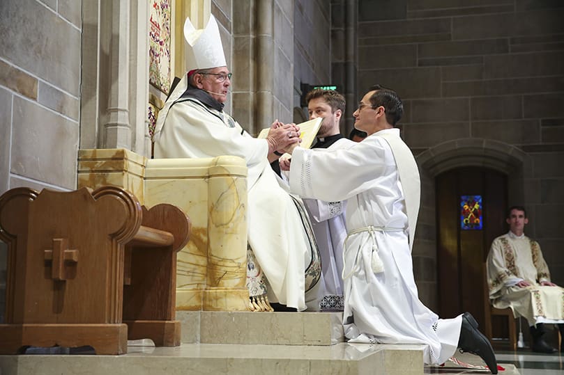 Miller Gómez Ruiz pledges his obedience to Archbishop Gregory J. Hartmayer, OFM Conv., and his successors during the June 27 rite of ordination to the priesthood at the Cathedral of Christ the King, Atlanta. Photo By Michael Alexander