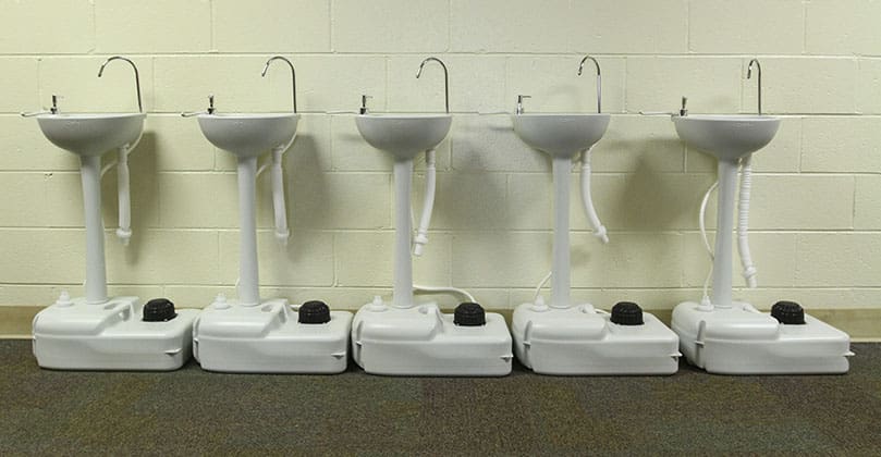 Students will find portable hand washing stations like the ones above strategically placed around St. Joseph School, Marietta, this year. Photo By Michael Alexander