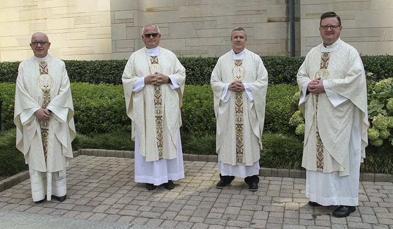 Silver jubilarians (l-r) Msgr. Francis McNamee, rector of the Cathedral of Christ the King, Atlanta, Father Lawrence Niese, pastor of St. Michael the Archangel Church, Woodstock, Father Paul Williams, pastor of St. Joseph Church, Dalton, and Msgr. Joseph Corbett, pastor of St. Jude the Apostle Church, Sandy Springs, were recognized for their 25 years of priestly service to the Catholic Church. Photo By Michael Alexander