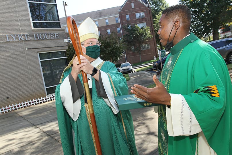Father Urey Mark, right, Lyke House chaplain and director, converses with Archbishop Gregory J. Hartmayer, OFM Conv., before the Oct. 18 dedication Mass. Photo By Michael Alexander