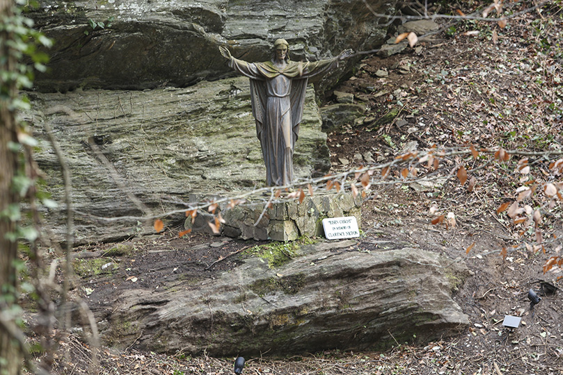 The phase one work revealed a Risen Christ statue, just to the right of the waterfall, that had been covered up by invasive species. The statue was a gift from a retreatant several years ago. Photo By Michael Alexander