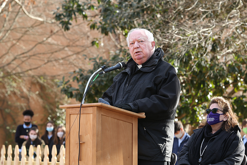 Msgr. Edward Dillon, pastor of Holy Spirit Church, Atlanta, gives some remarks about the presence of the “Angels Unawares” sculpture on the Holy Spirit Preparatory School campus and the importance of adhering to the church’s teachings on immigration. Photo By Michael Alexander
