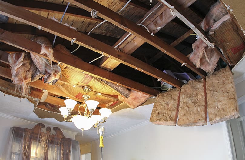 The tornado came toward the rear of the Garza home, so that part of the house has significant damage. Here you see the exposed ceiling above their dining room. Photo By Michael Alexander