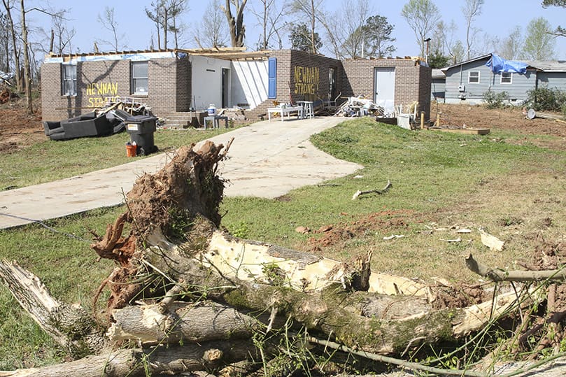The EF-4 tornado that tore through Newnan March 25 took the roof off of this neighborhood home. Nearly 1,800 of Newnan’s homes had significant damage, 120 homes are unlivable and 70 homes are completely destroyed. Photo By Michael Alexander