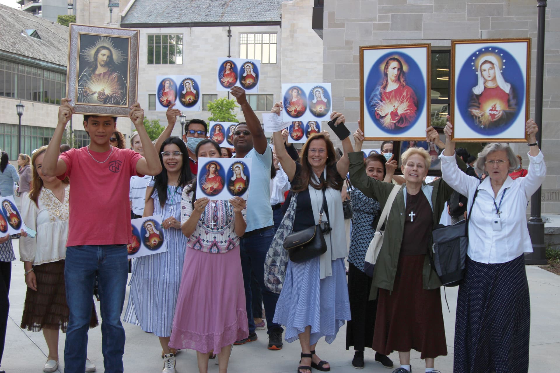 Enthusiastic members of the Cathedral of Christ the King and its mission prepare for the June 2 eucharistic procession and Holy Hour, which started from the Hyland Center courtyard and made its way into the sanctuary.Photo by David Pace