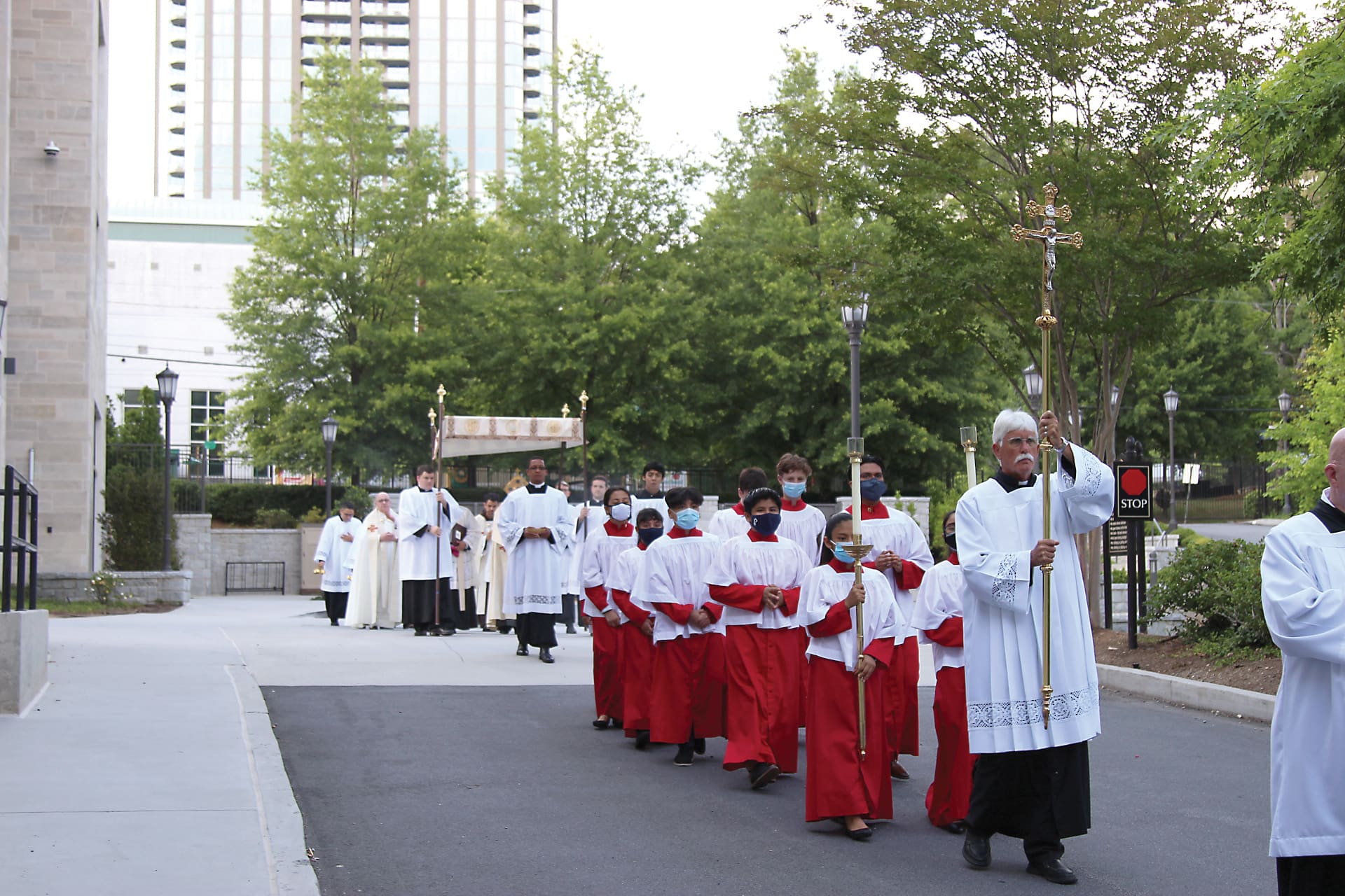 The eucharistic procession at the Cathedral of Christ the King in Atlanta marked the evening Vigil of Corpus Christi. Archbishop Gregory Hartmayer led the June 2 procession. Photo by David Pace