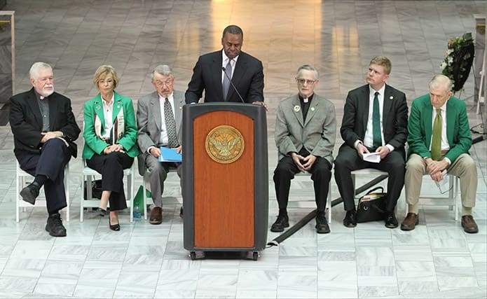 Atlanta mayor Kasim Reed shares some words about Father O’Reilly during the March 11 memorial ceremony in the Atlanta City Hall atrium. Seated behind the mayor are (l-r) Msgr. Henry Gracz, pastor of the Shrine of the Immaculate Conception, Dot Mears, Father O’Reilly memorial committee member, Jay McLendon, coordinator of the Father O’Reilly memorial service, Father John Kieran, chaplain of the Hibernian Benevolent Society of Atlanta, Shane Stephens, consul general of Ireland, and Frank McGing, president of the Hibernian Benevolent Society of Atlanta. Photo By Michael Alexander