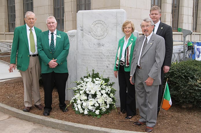 (L-r) Frank McGing, president of the Hibernian Benevolent Society of Atlanta, Davant Turner and Dot Mears, Father O’Reilly memorial committee members, Jay McLendon, coordinator of the Father O’Reilly memorial service and Shane Stephens, consul general of Ireland, pose for a photograph at the Father Thomas O’Reilly memorial on the northwest grounds of Atlanta City Hall. Photo By Michael Alexander