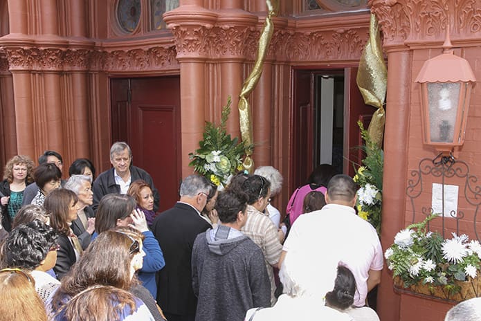 After the Holy Door of Mercy is opened at the Sacred Heart of Jesus Basilica, Atlanta, people enter through it on their way to the 12:10 p.m. Mass. Photo by Michael Alexander