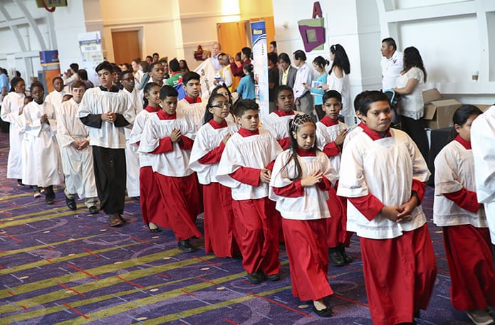 Altar servers from around the Archdiocese of Atlanta participate in the procession for the closing vigil Mass of the Eucharistic Congress. Photo By Michael Alexander