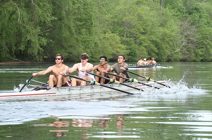 (Foreground, l-r) Peter Bickel, a senior at Roswell High School, Roswell, Jack Harrison, home schooled, Baqar Husain, a senior at Walton High School, Marietta, and Mike Arias, a junior at Blessed Trinity High School, Roswell, row in quad shell (four rowers and no coxswain). They are displaying a type of rowing called sculling (each rower uses two oars). Photo By Michael Alexander