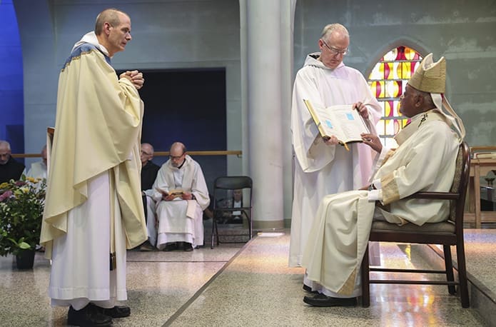 Abbot-elect Augustine Myslinski, OCSO, stands before Archbishop Wilton D. Gregory during the rite of examination. Photo By Michael Alexander