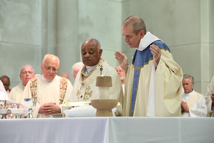 New abbot Dom Augustine Myslinski, OCSO, right, leads a portion of the prayer during the Liturgy of the Eucharist. Photo By Michael Alexander