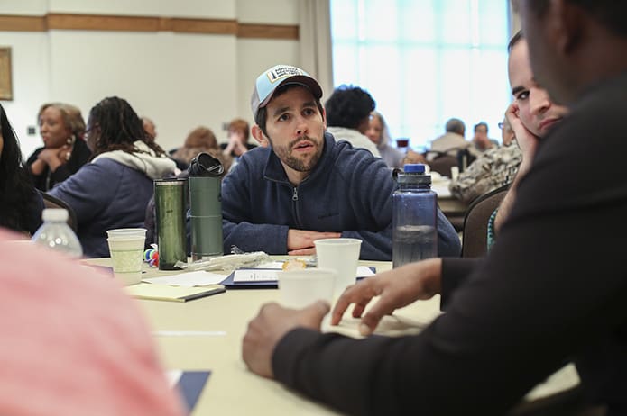 Mike Callahan, center, of Immaculate Heart of Mary Church, Atlanta, participates in a table discussion about racism at the parish level. He joined nearly a 120 people at the Cathedral of Christ the King, Atlanta, for a program entitled An Honest Look at Racism. Photo By Michael Alexander