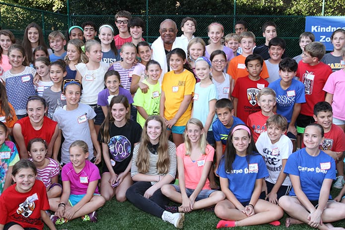 After toweling off, Archbishop Wilton D. Gregory, back row, center, poses with nearly 100 middle school students at Our Lady of the Assumption Church. A video of the Archbishop Wilton D. Gregoryâs Ice Bucket Challenge can be found at https://www.youtube.com/watch?v=Z0YhXstkvyg&feature=youtu.be&a.