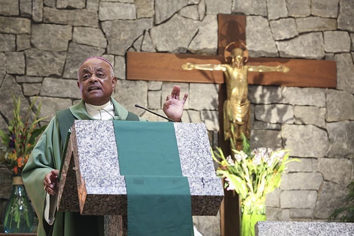 During the annual Mass, Aug. 20, to welcome students back to campus at the University of Georgia Catholic Center in Athens, Archbishop Wilton D. Gregory took time during the homily to express his anguish about the hateful and racist acts of white supremacists on the campus of the University of Virginia in Charlottesville, Va. Archbishop Gregory expressed his hope that the congregation would stand up to oppose any form of bigotry at their school. Photo By Michael Alexander