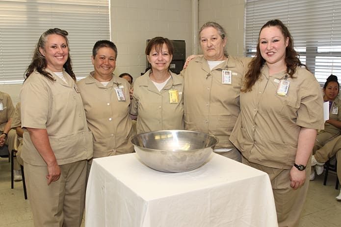 During a May 6 liturgy at Lee Arrendale State Prison in Alto, inmates (l-r) Melissa Deal and Alma B. Mitchell were confirmed, while Beverly Dawn Barber, Carla Rae Hopwood and Felicia Nicole Greenway were baptized and confirmed. Photo By Michael Alexander