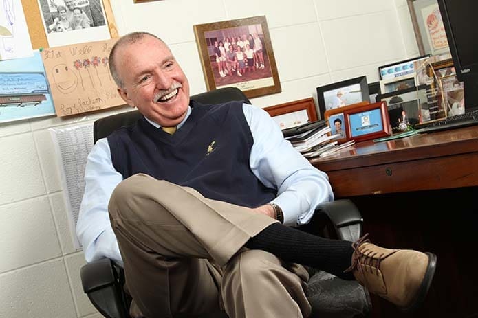 St. Pius X High School’s Mark Kelly retired at the end of 2017. Kelly credits a number of people for getting 85 percent participation among students in sports and hanging some 114 state championship and runner-up banners during his 31-year tenure as athletic director. Photo By Michael Alexander